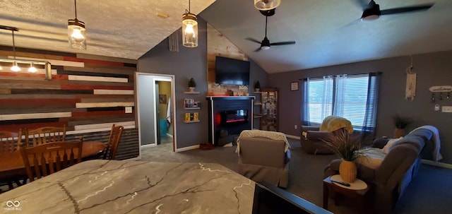 living room featuring ceiling fan, vaulted ceiling, and carpet flooring