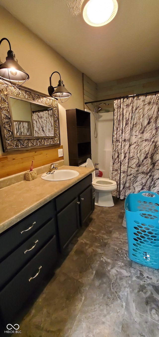 bathroom with toilet and vanity