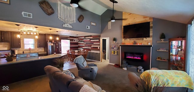 living room featuring high vaulted ceiling, carpet flooring, and ceiling fan