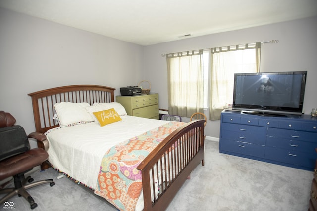 bedroom with light carpet