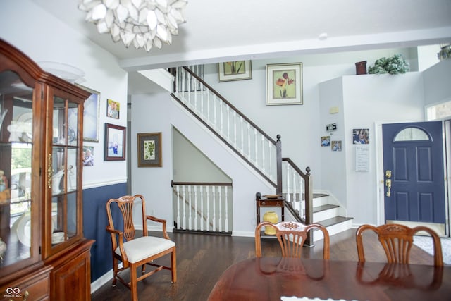 entryway featuring a notable chandelier and dark hardwood / wood-style floors