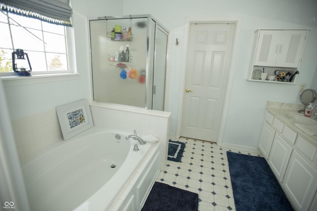 bathroom featuring separate shower and tub and vanity