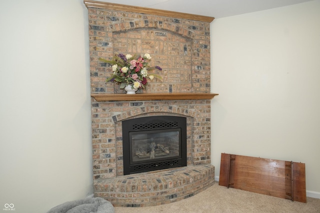 details featuring a fireplace and carpet floors