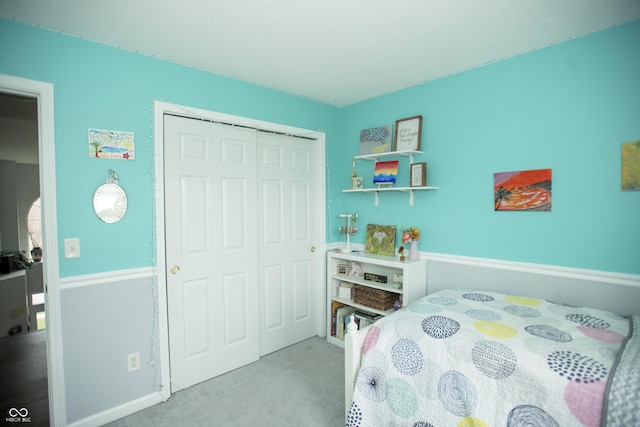 carpeted bedroom featuring a closet