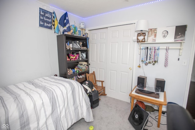 bedroom featuring a closet and carpet floors