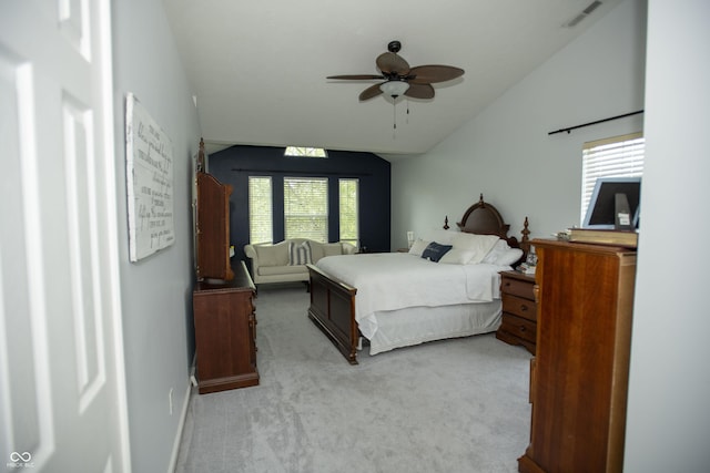 carpeted bedroom with lofted ceiling and ceiling fan