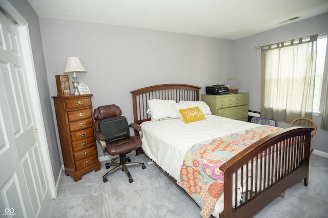 bedroom with light colored carpet