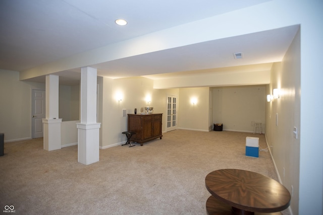 basement featuring light carpet