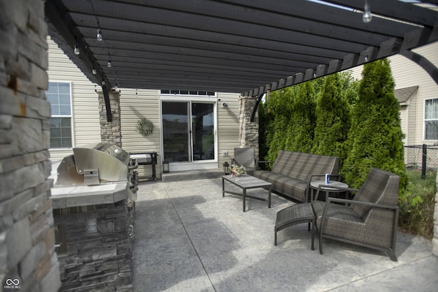 view of patio / terrace with area for grilling, an outdoor living space, and a pergola