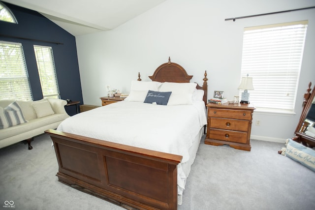 carpeted bedroom featuring vaulted ceiling