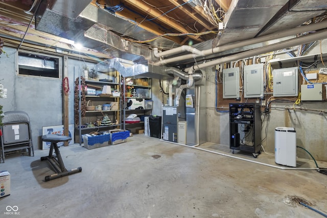 basement with heating unit and electric panel