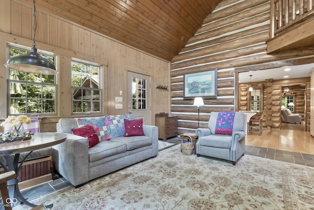 living room with wood ceiling and high vaulted ceiling