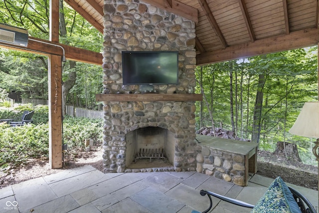 view of patio with an outdoor stone fireplace