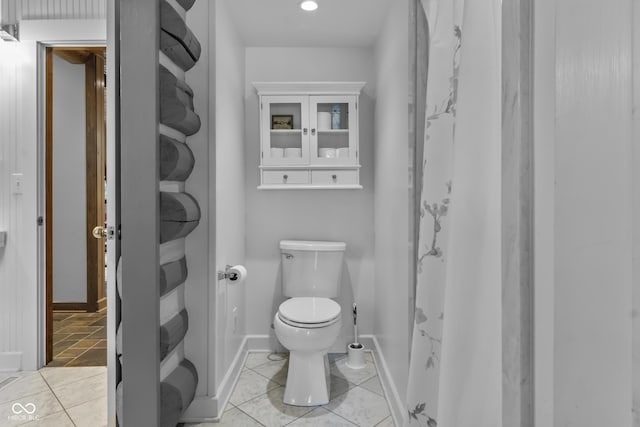 bathroom featuring tile patterned floors and toilet