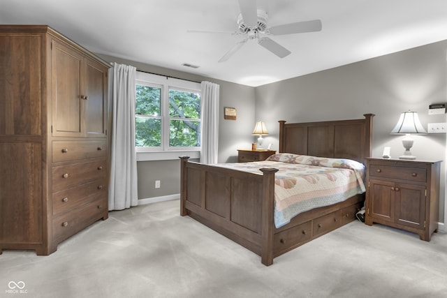 bedroom featuring ceiling fan and light carpet