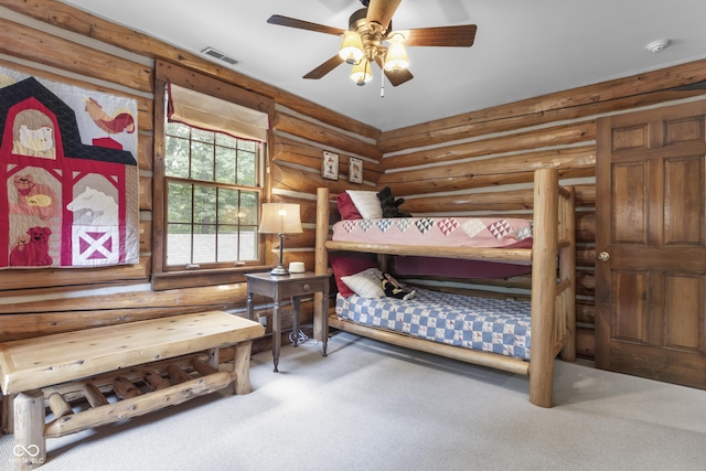 bedroom with carpet flooring and rustic walls