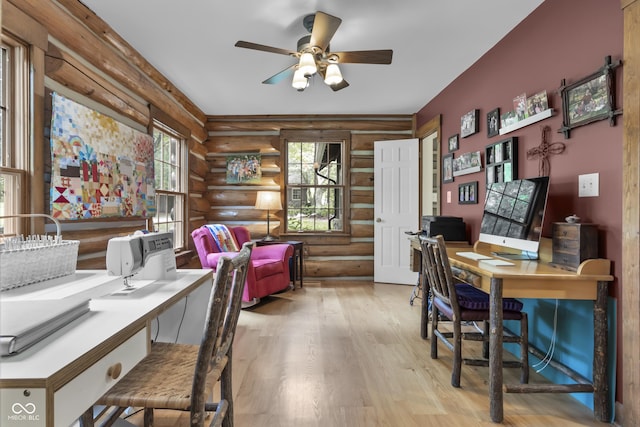 office featuring ceiling fan and light hardwood / wood-style flooring