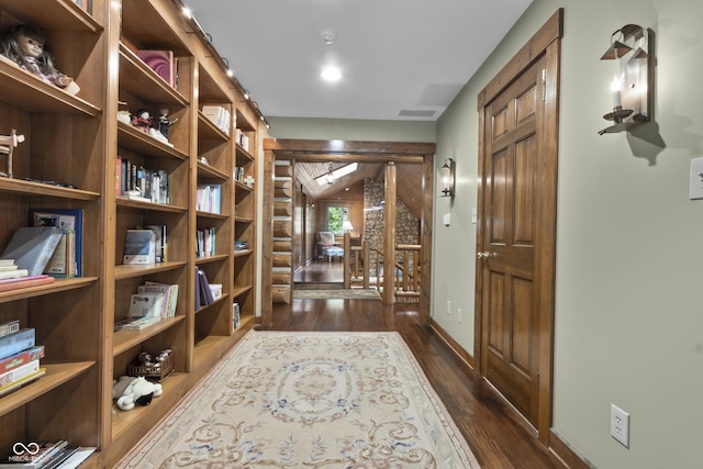 corridor featuring dark hardwood / wood-style floors