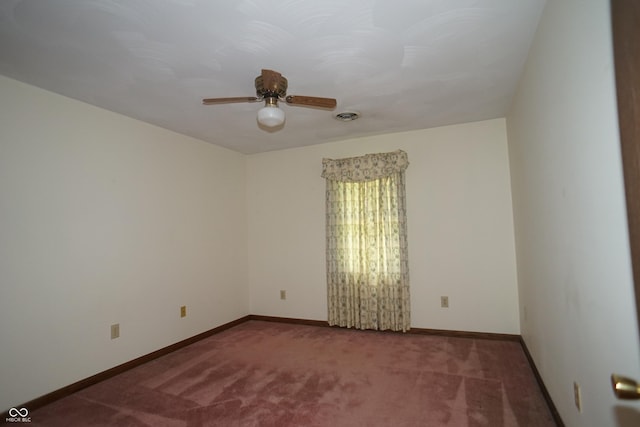 spare room with ceiling fan and carpet flooring