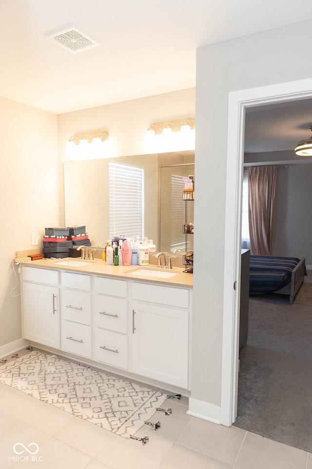 bathroom featuring tile patterned flooring and vanity