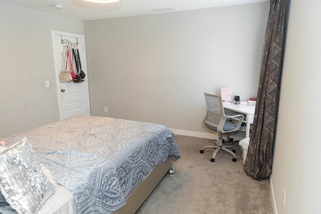 bedroom with light colored carpet