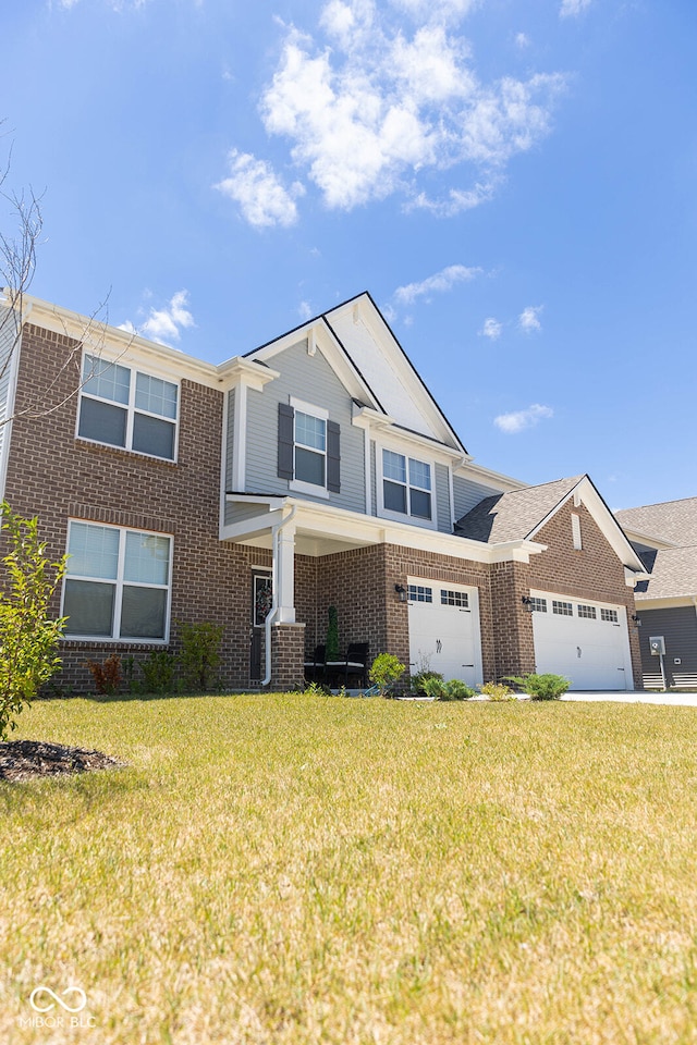 view of front of property featuring a garage and a front yard