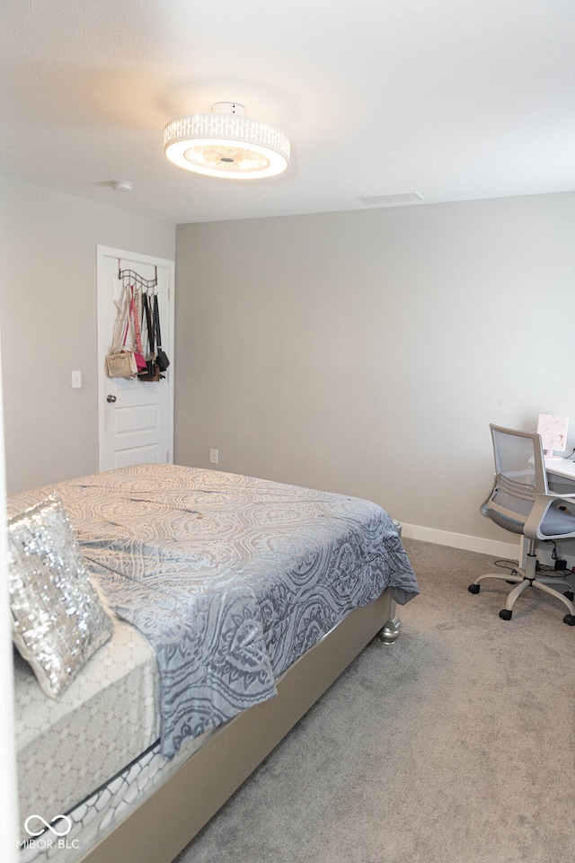 carpeted bedroom featuring a closet