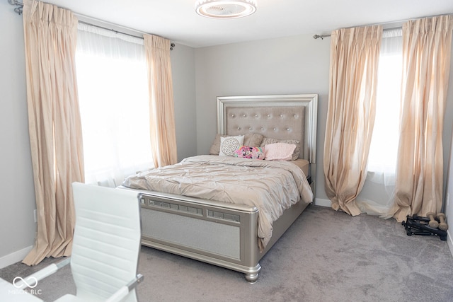 bedroom with light colored carpet