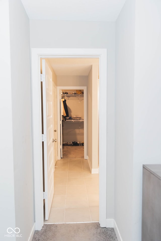 hallway featuring light tile patterned flooring