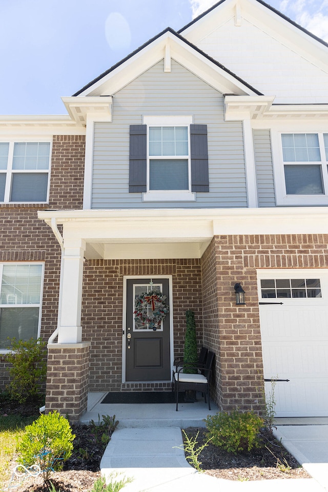 exterior space with a garage and covered porch