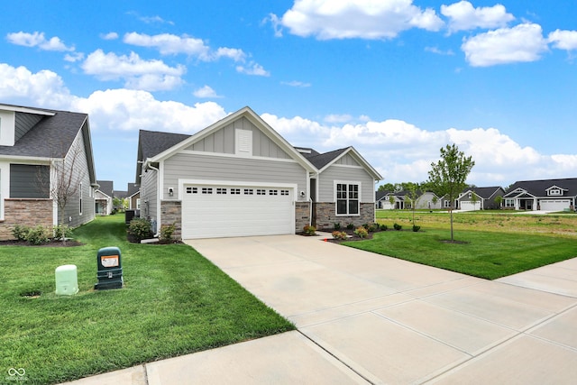 view of front of property featuring a garage and a front lawn