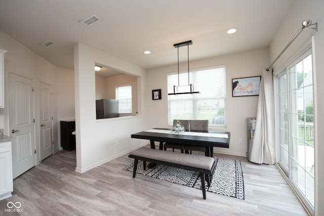 6748 Fallen Leaf Dr, Whitestown, IN 46075 - dining space with light wood-type flooring, a chandelier, baseboards, and recessed lighting