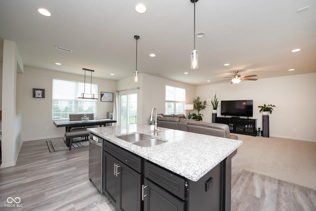 6748 Fallen Leaf Dr, Whitestown, IN 46075 - kitchen featuring a sink, stainless steel dishwasher, recessed lighting, plenty of natural light, and a kitchen island with sink