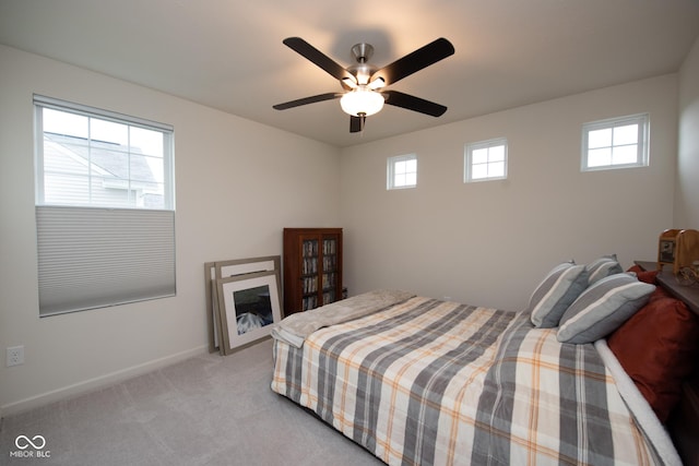 6748 Fallen Leaf Dr, Whitestown, IN 46075 - bedroom with multiple windows, light colored carpet, baseboards, and a ceiling fan