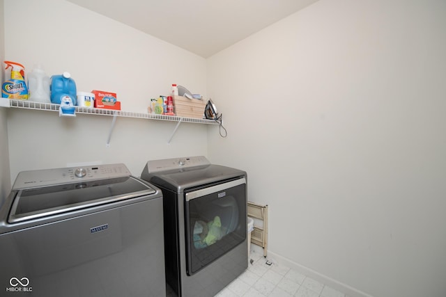 6748 Fallen Leaf Dr, Whitestown, IN 46075 - washroom with washing machine and dryer and baseboards