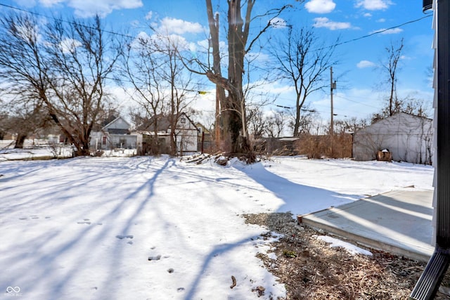 view of yard layered in snow