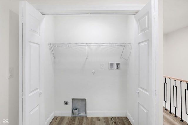 laundry room with gas dryer hookup, hookup for an electric dryer, light wood-type flooring, and washer hookup