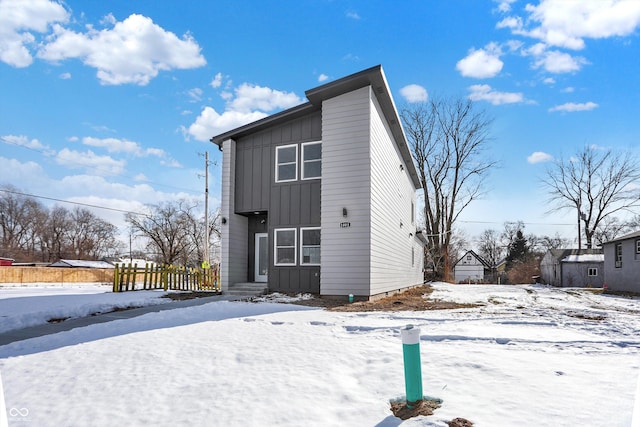 view of snow covered house