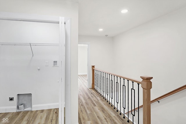 hall with light wood-type flooring