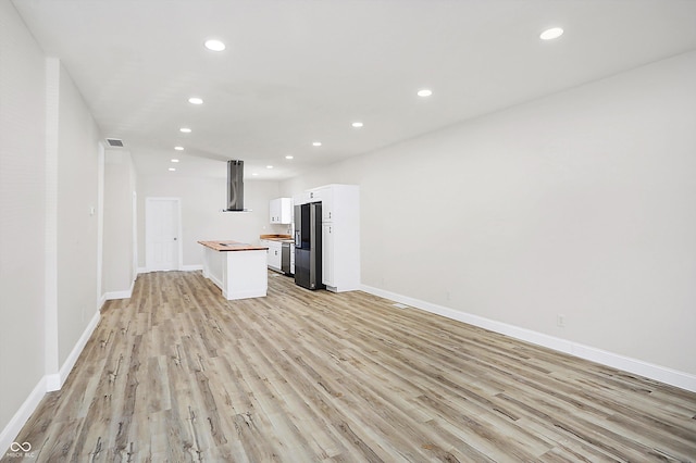 unfurnished living room featuring light hardwood / wood-style floors