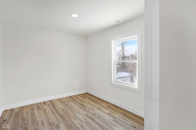 unfurnished room with light hardwood / wood-style flooring