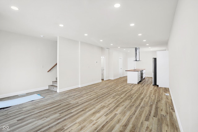 unfurnished living room with light hardwood / wood-style floors