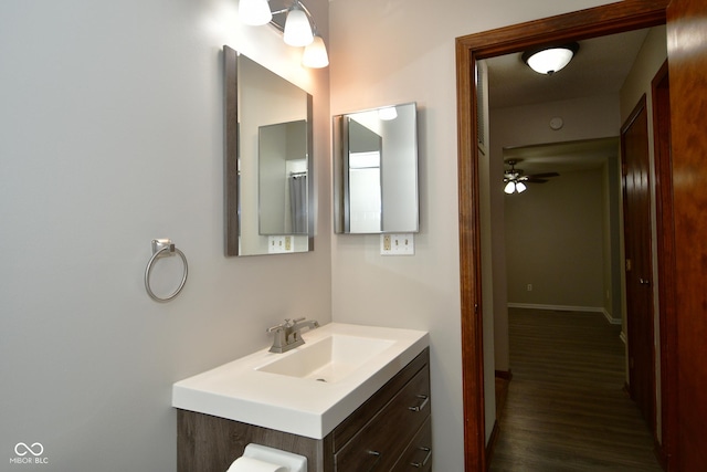 bathroom with vanity, hardwood / wood-style floors, and ceiling fan