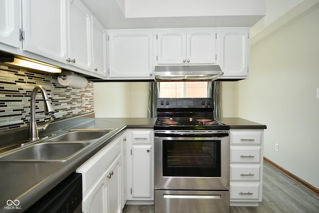 kitchen featuring sink, stainless steel electric range, backsplash, white cabinets, and light wood-type flooring