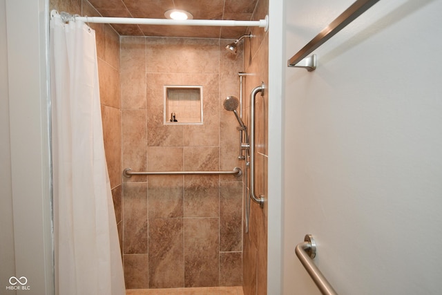 bathroom featuring a shower with curtain