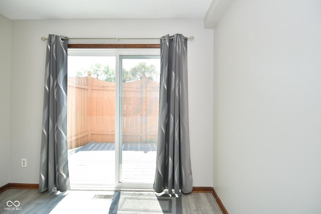 doorway to outside featuring hardwood / wood-style flooring