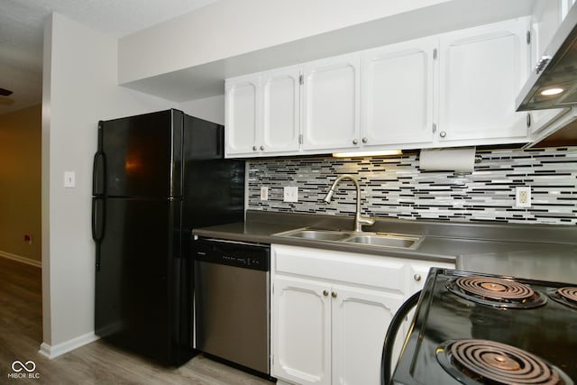 kitchen featuring white cabinets, sink, exhaust hood, and black appliances