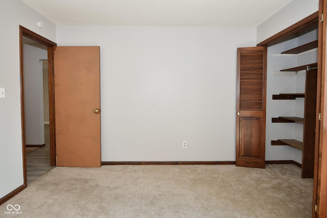 unfurnished bedroom featuring light colored carpet