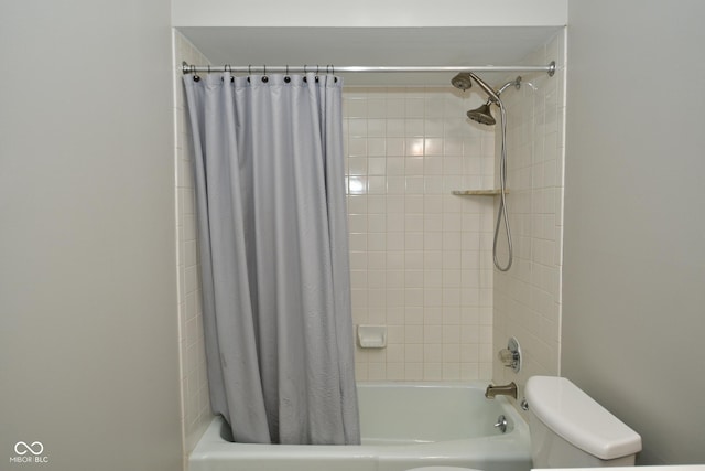 bathroom with shower / bath combo and toilet