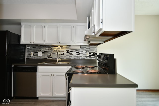 kitchen featuring tasteful backsplash, white cabinetry, sink, and black appliances